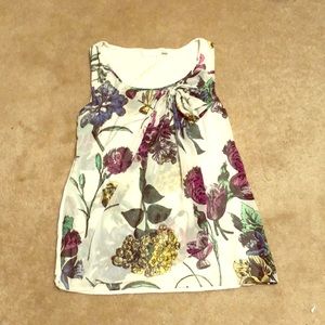 Flowered sleeveless shirt.